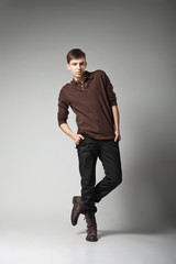 Young male fashion model posing in casual outfit