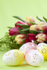 Fototapeta na wymiar Flowery Easter eggs and tulips