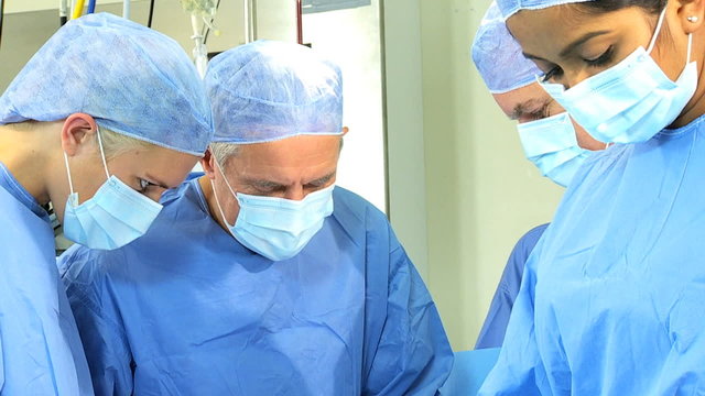 Multi Ethnic Surgical Team Operating Theater Close Up