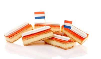Pile of traditional Dutch pastry called tompouce with flags