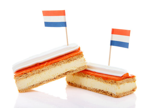 Traditional Dutch pastry called tompouce  with flags