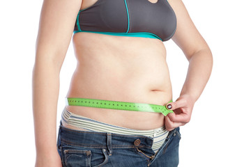 Fat middle-aged woman measuring her waist. Isolated on white bac