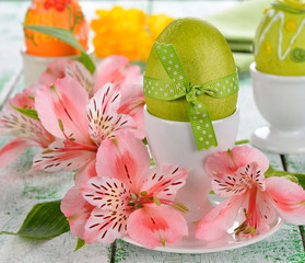 Easter eggs and flowers on a white background