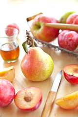 Naklejka na ściany i meble Fresh organic plums, pears and apples