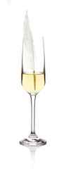A feather in a glass of white wine showing smoothness and classy