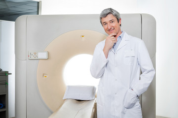 Doctor Standing By Ct Scan Machine