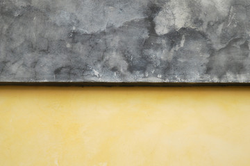 Yellow grunge cement wall background