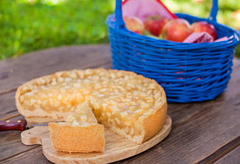 Fresh  apple pie and fruits on wooden table