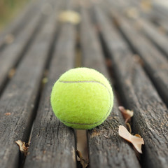 tennis balls on wood floor © yoki5270