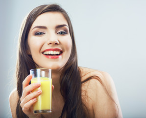 Female model hold orange juice glass isolated .