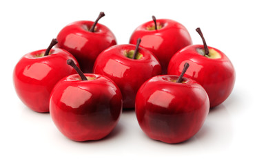 A set of seven red plastic apples