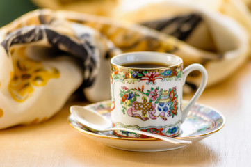 Time for a break. The Lady drinks a cup of warm and flavored coffee