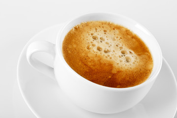 A cup of delicious espresso coffee on a white background