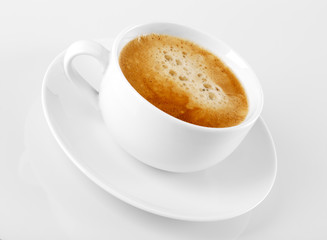 A cup of delicious espresso coffee on a white background