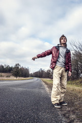 Man Hailing on a roadside of the road