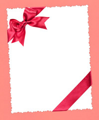 blank paper sheet with red bow on pink