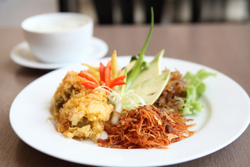 Jusmine rice in iced water such deep fried pork, onion, chili. A