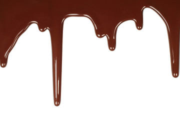 Melted chocolate dripping on white background .