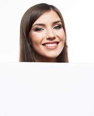 Young smiling woman show blank board.