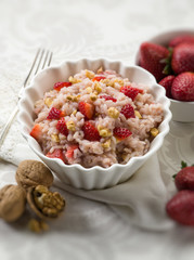 risotto with strawberries and nuts, selective focus