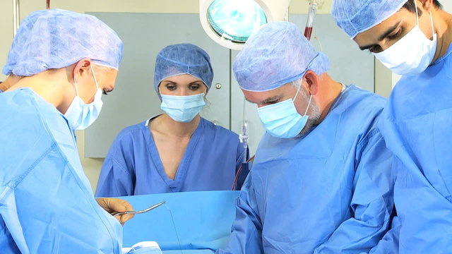 Male Female Doctors in Operating Room