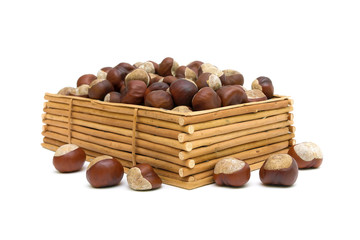 chestnuts in a wooden box isolated on white background