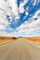 Long empty road running to the far horizon