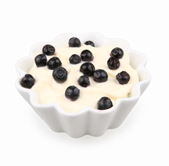 blueberries cream in a white bowl isolated on white
