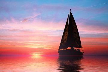 Sailing at sunset on the ocean