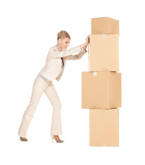 businesswoman moving big boxes