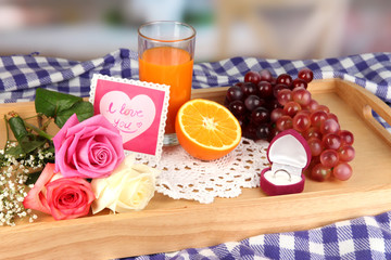 Breakfast in bed on Valentine's Day on room background