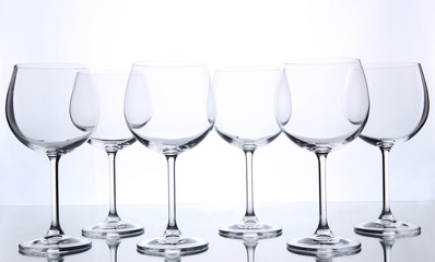 Empty wine glasses arranged and isolated on white