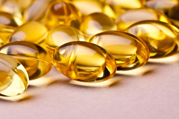 Cod liver oil omega 3 gel capsules isolated on white background 
