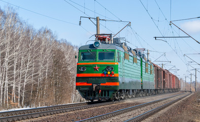 Obraz premium Freight train hauled by electric locomotive. Ukraine