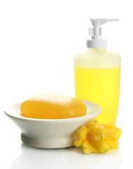 Bottle and soap-dish with soap isolated on white