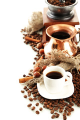 Cup and pot of coffee and coffee beans, isolated on white