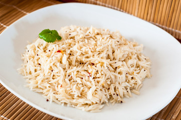Cooked rice on white plate