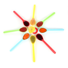 Baby puree in spoons with nipple isolated on white