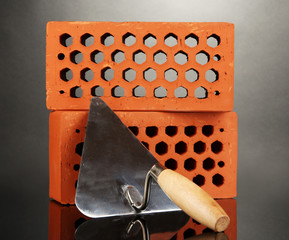 Metal tool for building and bricks isolated on black