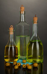 Original glass bottles with oil isolated on black