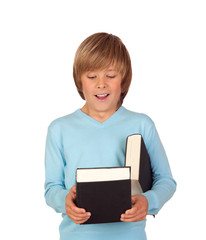 Obraz premium Surprised preteen boy with a book