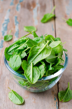 Spinach in a glass bowl on the table