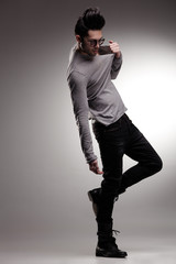sexy fashion man model dressed casual posing dramatic in the