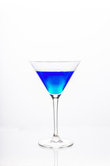 Cocktail glass with blue alcohol