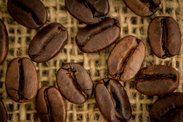 Coffee beans resting on sack