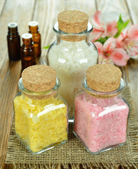 Sea salt in glass bottles and flower