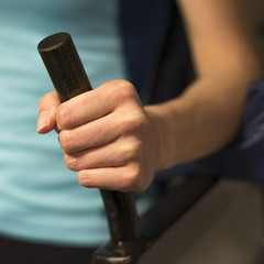 Woman doing exercises on a abs machine in a gym