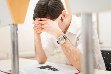 Stressed student reading a book