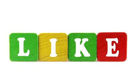 like - isolated text in wooden building blocks