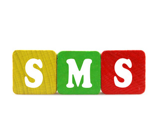 sms - isolated text in wooden building blocks